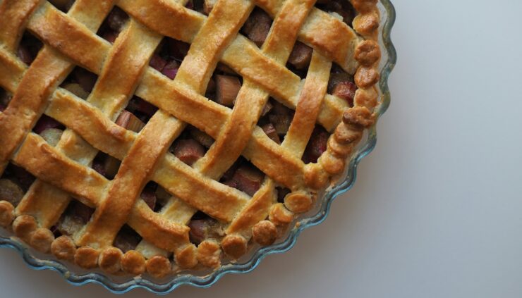 Top-down photo of an apple pie with a lattice top