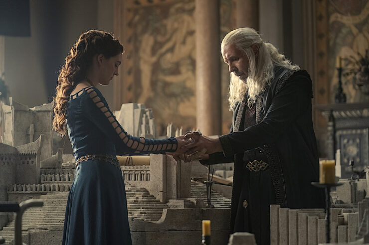 Alicent (Olivia Cooke) stands with King Viserys (Paddy Considine) in the midst of his model of Old Valyria in House of the Dragon.