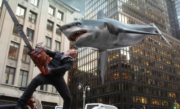 Fin Shepard (Ian Ziering) wields a chainsaw against an incoming shark in a scene from Sharknado 2: The Second One